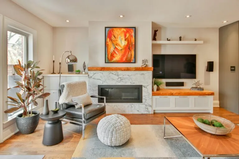 Living room with fireplace, built-in shelving and modern seating